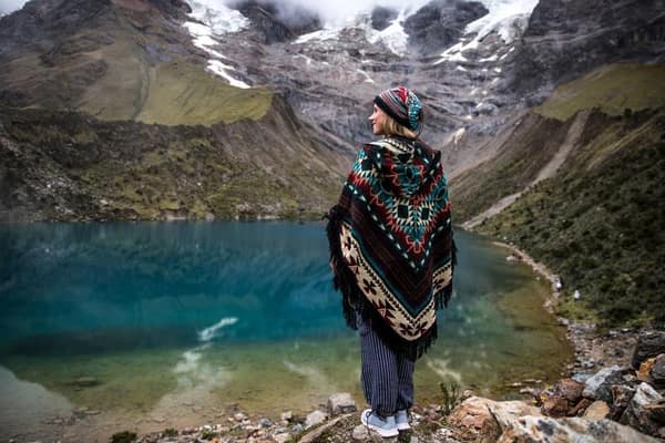 Turquoise Humantay Lake ringed by snow, Cusco
